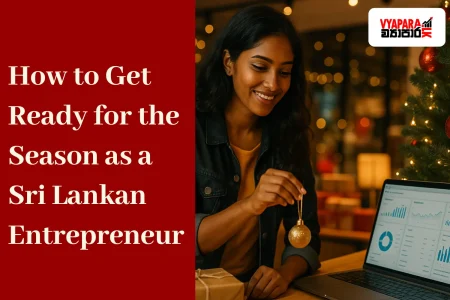 Season | A young Sri Lankan entrepreneur decorating her modern retail shop for Christmas while checking an online sales dashboard on her laptop. Festive lights, gifts, and a Christmas tree create a warm seasonal atmosphere, with the text “How to Get Ready for the Season as a Sri Lankan Entrepreneur” and the Vyapara.lk logo displayed on the image.