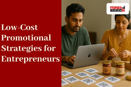 A banner image featuring two Sri Lankan entrepreneurs working at a desk with a laptop, jars labeled “Spicy Mix” and “Chili Paste,” and printed QR codes. The left side displays a red background with white text reading “Low-Cost Promotional Strategies for Entrepreneurs” and