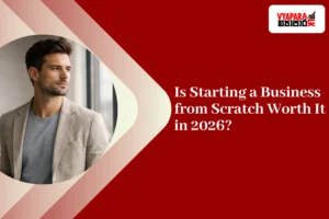 business | Handsome young entrepreneur looking out a window, representing starting a business in 2026.